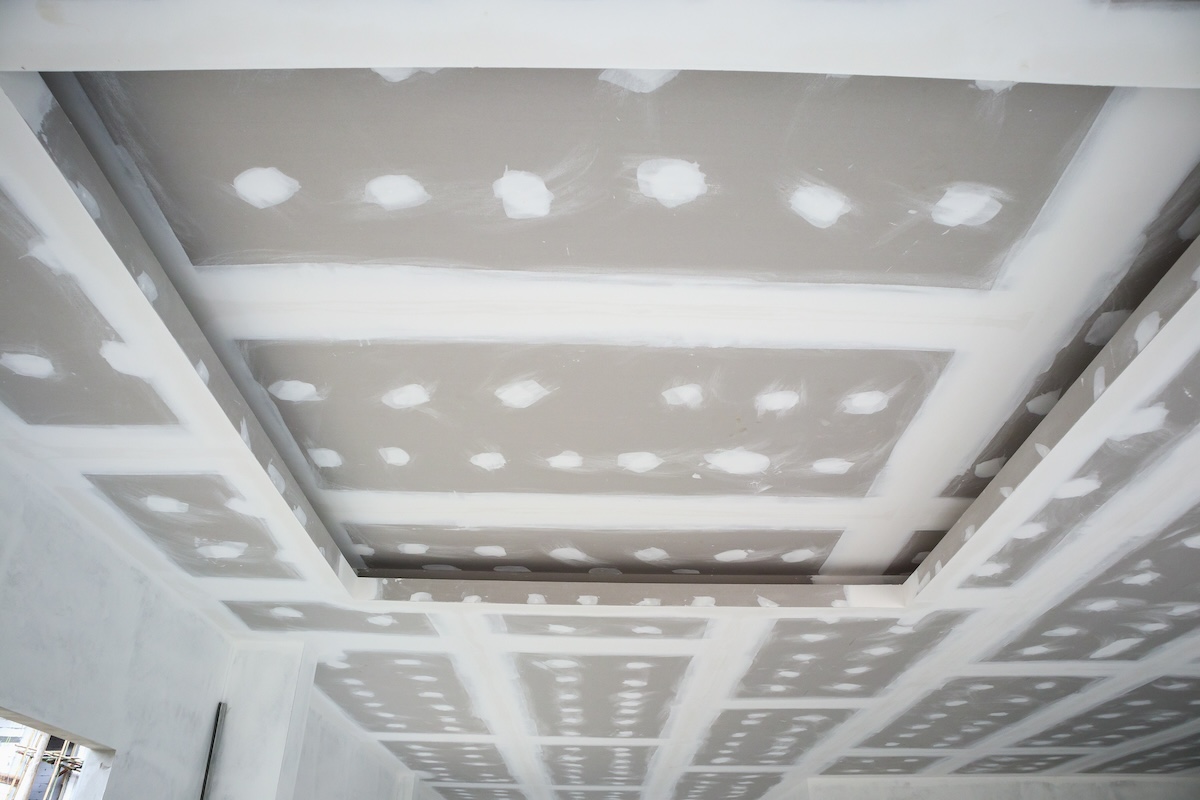ceiling gypsum board installation at construction site